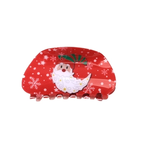 Pince à cheveux de Noël rouge avec motifs Père Noël et flocons sur fond blanc