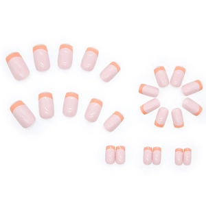 Short square press-on nails in milk tea mousse color with French peach orange tips