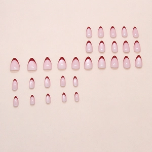 Classic French tip press on nails with deep red tips and glossy nude pink base
