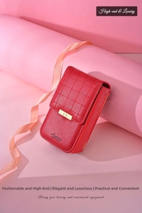 Detail of red quilted PU leather crossbody bag with gold metal buckle on pink display stand