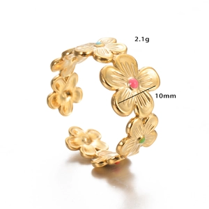 Detail view of gold floral open ring with colorful enamel dots and 10mm flower pattern
