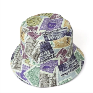 Detailed view of reversible bucket hat featuring vintage stamp patterns and sturdy canvas