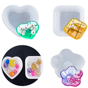 Detail of heart and flower silicone molds for resin storage boxes with glitter and pearls