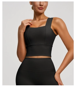 Detail of wide straps and square neck on high-support black yoga sports bra