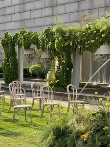 Detailed view of realistic artificial moss arch for outdoor wedding decor and forest events