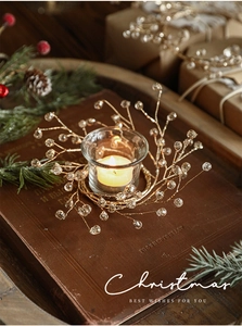 Macro shot of French vintage acrylic bead wreath and glass candle holder for Christmas decor