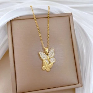 Elegant gold titanium steel necklace featuring double butterflies with sparkling cubic zirconia
