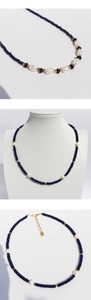 Detail of lapis lazuli beads, baroque pearls, and gold-plated clasp on adjustable necklace