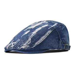 Vintage washed blue denim cadet cap with distressed ripped details and adjustable strap