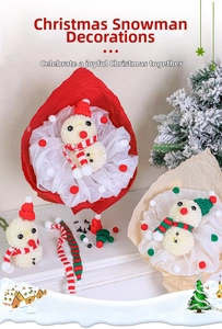 Close-up of DIY Christmas snowman flower bouquet made of pom poms with mini knit hats