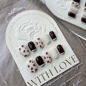 Handmade press-on nails set in brown cow print and white 3D knit patterns