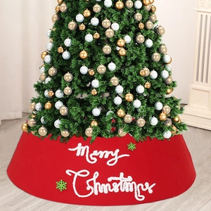 Festive red felt Christmas tree skirt with Merry Christmas embroidery and green snowflakes