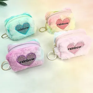 Close-up of plush heart coin purses in various colors with gold keychains and embroidery