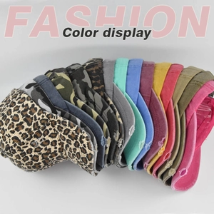 Detail view showing variety of leopard print and camo ponytail baseball caps colors