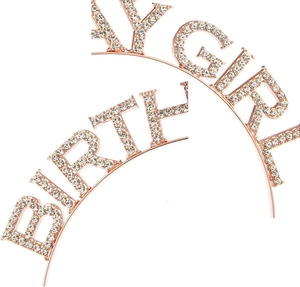 Close-up of sparkling rose gold Birthday Girl headband with inlaid rhinestones