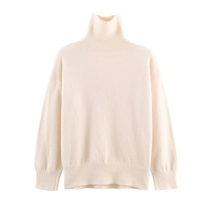 Women's cream oversized turtleneck sweater with thick ribbed knit cuffs and hem detail