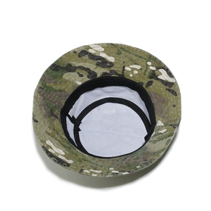 Detail of camouflage bucket hat showing interior sweatband and 100% cotton wash label