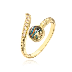 Detailed macro of 18K gold plated ring with blue evil eye gem and zircon stones