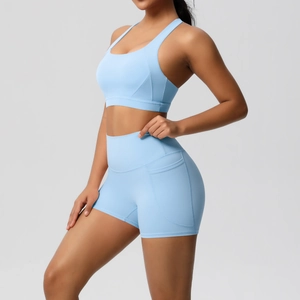 Detail shot of light blue yoga set featuring a side pocket on high-waisted shorts