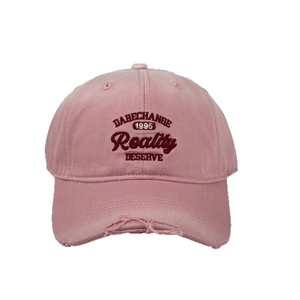 Distressed pink baseball cap with 3D embroidery and wide curved brim for a vintage look