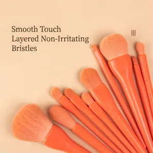 10-piece orange makeup brush set for foundation and eyeshadow on a neutral background