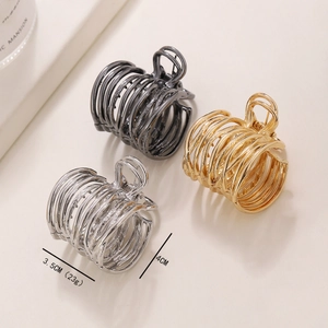 Three-color metal hair claws in black, gold and silver showing 3.5x4cm size and 23g weight