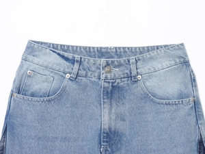 Detailed view of denim jeans waist featuring metal button and stitching texture