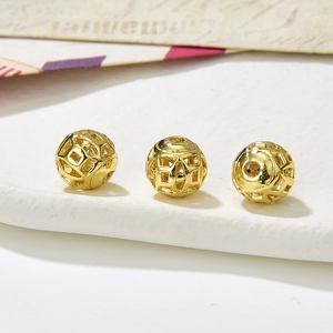 Macro shot of 8-9mm vintage gold hollow alloy round beads for DIY jewelry making