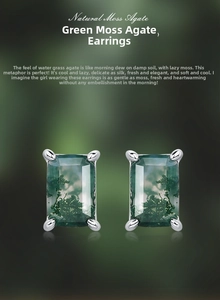 Macro shot of silver stud earrings with rectangular green moss agate in a 4-claw setting