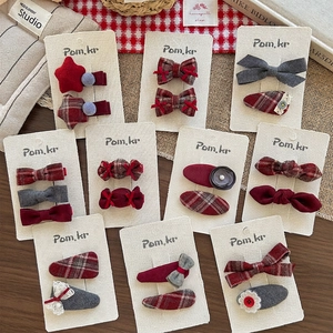 Handmade Korean style bow hair clips in red and grey fabric on display cards