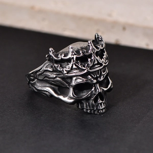 Macro side view of vintage punk skull ring with crown in oxidized stainless steel