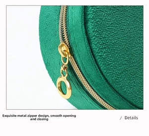 Macro detail of high-end green velvet jewelry pouch with smooth gold ring zipper