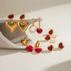 Golden stainless steel earrings collection with red heart charms and white pearls