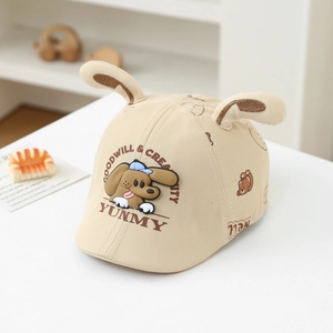 Beige baby baseball cap with 3D ears and cartoon dog patch in a Nordic setting