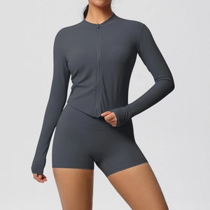 Close-up of dark grey yoga set featuring thumbhole sleeves and high waist fitness shorts