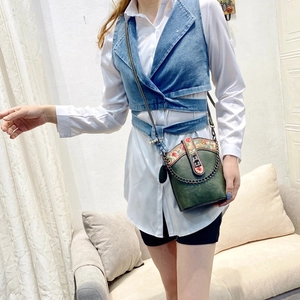 Dark green bucket crossbody bag with floral embroidery and metal chain strap for women