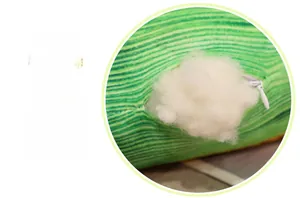 Detail of plush toy green striped fabric with white invisible zipper and soft fiber filling