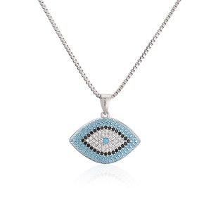 Silver devil's eye pendant necklace with blue and white zircon stones on white background