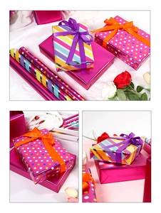 Detailed view of colorful striped and polka dot gift wrapping paper rolls for birthdays