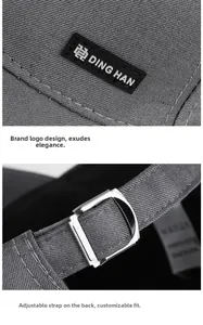 Detail of grey baseball cap featuring DING HAN logo and silver metal adjustable buckle