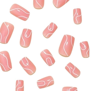 Minimalist peach pink press-on nails with white abstract lines in a square-oval shape