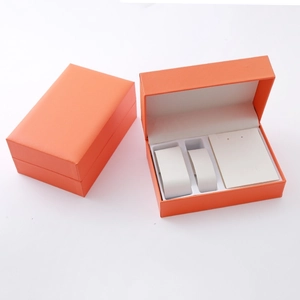 Detailed orange PU leather jewelry box with compartments for watch and necklaces