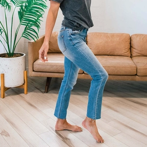 Minimalist summer light blue straight leg jeans with raw hem and faded finish details