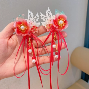 Detail of red floral Hanfu hair clip with tassels and long silk ribbons for girls