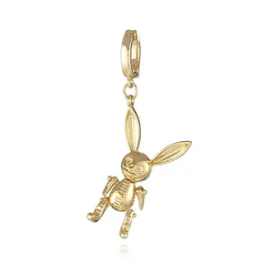 Detail of 18k gold plated rabbit pendant with movable joints and circular spring clasp