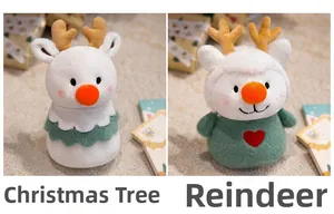 Close-up of plush Christmas tree and reindeer dolls with soft fabric and festive details