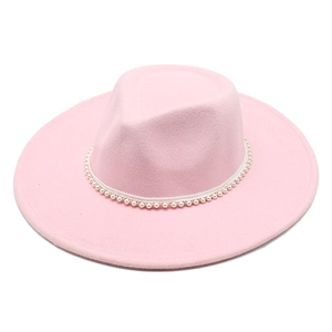 Close-up of pink wool fedora hat with elegant pearl beaded trim on a white background