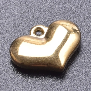 Macro shot of 18k gold plated puffy heart charm with mirror polished stainless steel surface