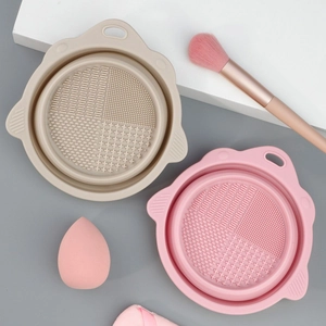 Close-up of a foldable silicone makeup brush cleaning bowl with four texture patterns