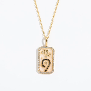 Detailed view of Scorpio zodiac rectangular pendant with gold finish and zircon inlay